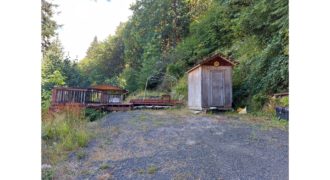 19031  Large Black Tank, Bare Site w/deck and shed