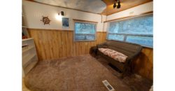 21104  Cute Vintage RV with Forest in Your Back Yard